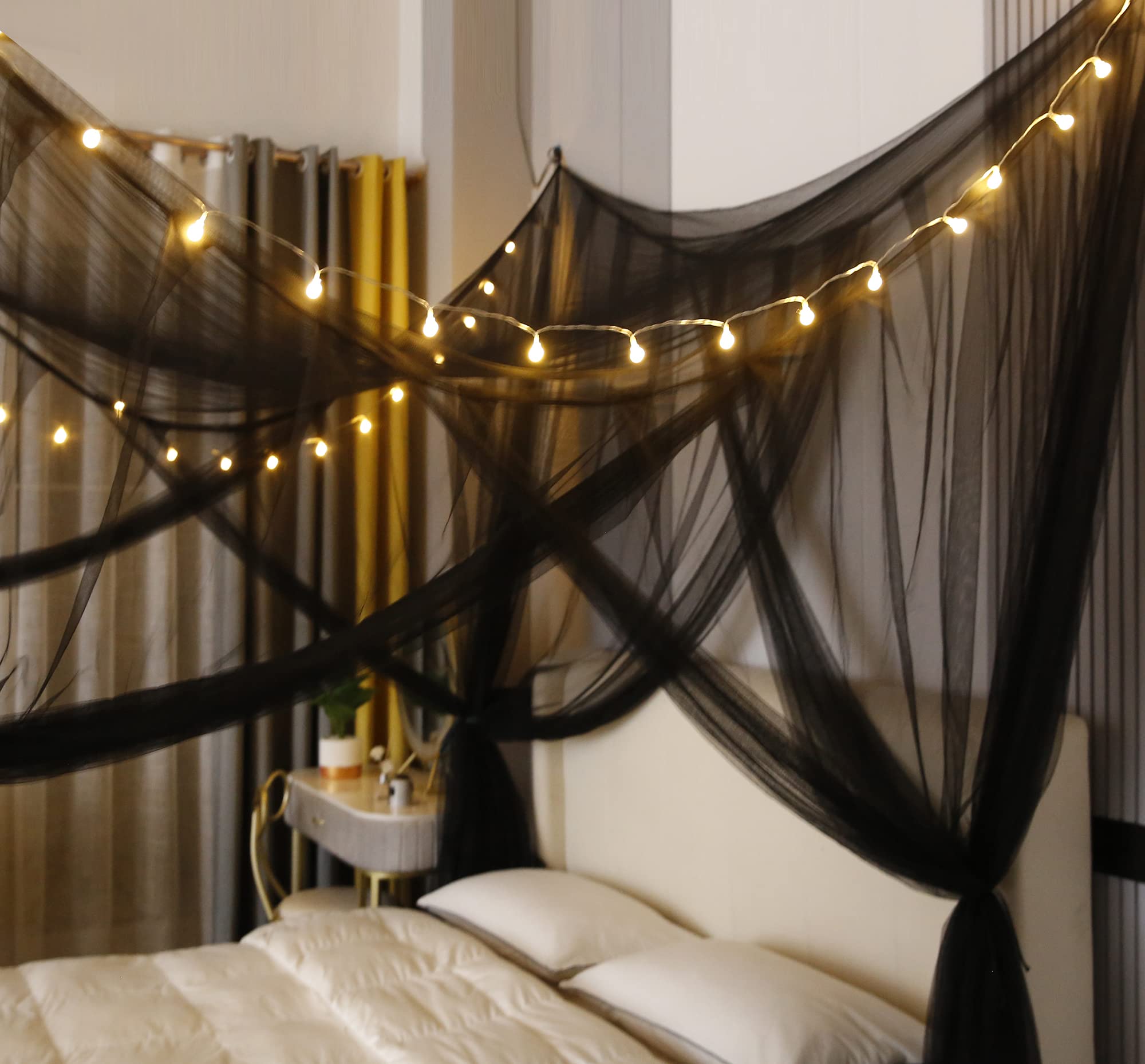 Mengersi canopy on king bed highlighting versatile decor for rooms