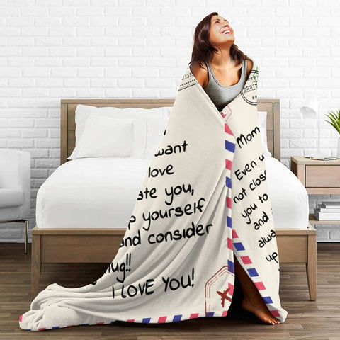 Menghao Dear Mom blanket draped on couch for cozy evenings
