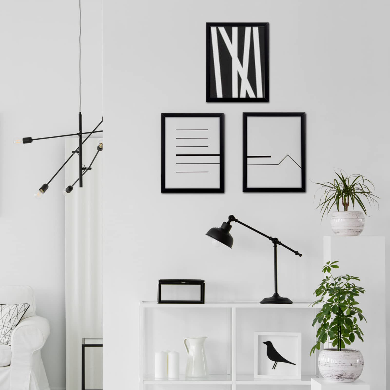 MENNTHUI 20x24 black frame in a styled living room setup.