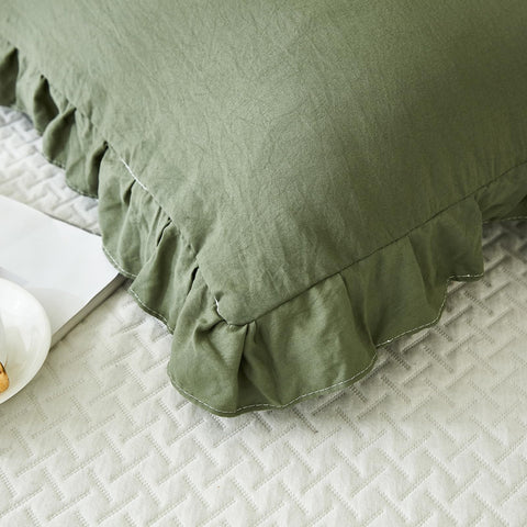 Merryword olive-green color on bed complements various palettes.