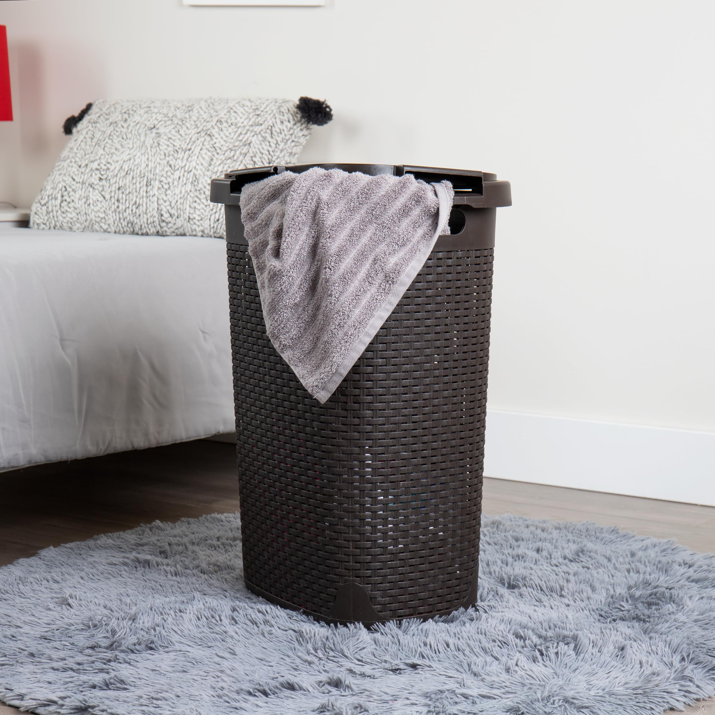 Mind Reader Slim Laundry Hamper narrow profile in a closet corner for vertical storage.