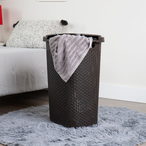 Mind Reader Slim Laundry Hamper narrow profile in a closet corner for vertical storage.
