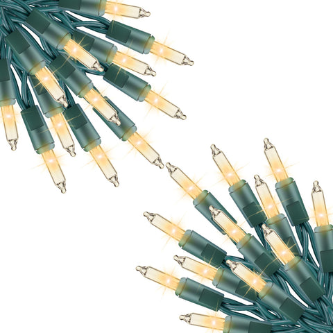 Minetom clear Christmas lights on a 40 ft run illuminate indoor trees with even brightness.
