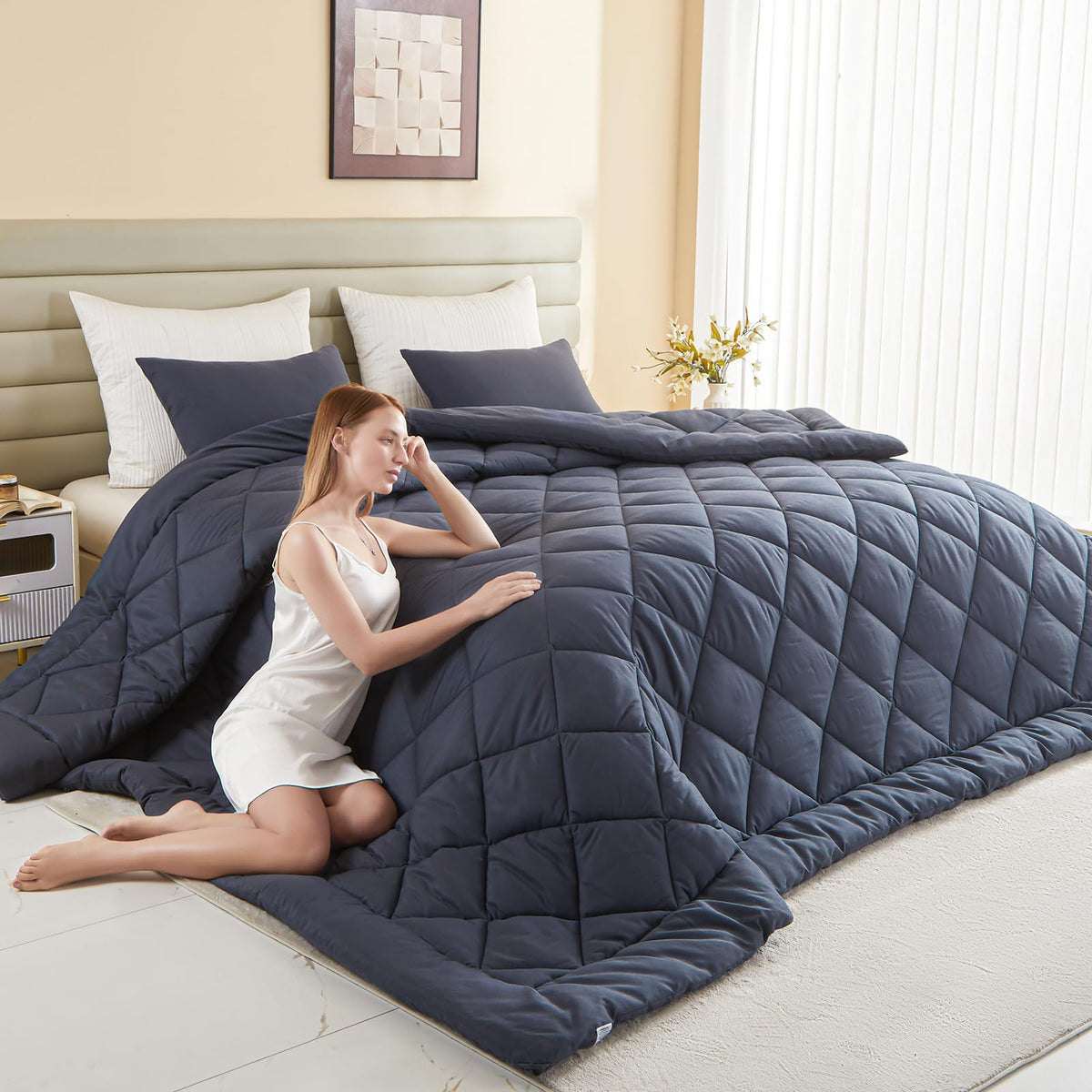 MIOTO oversized king comforter on bed provides full coverage and easy nightly comfort.