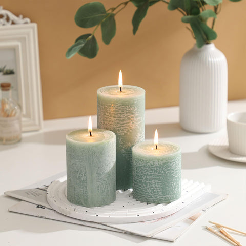MIRASCENTS Sage Green Pillar Candles on a mantel add cozy, long-lasting light.