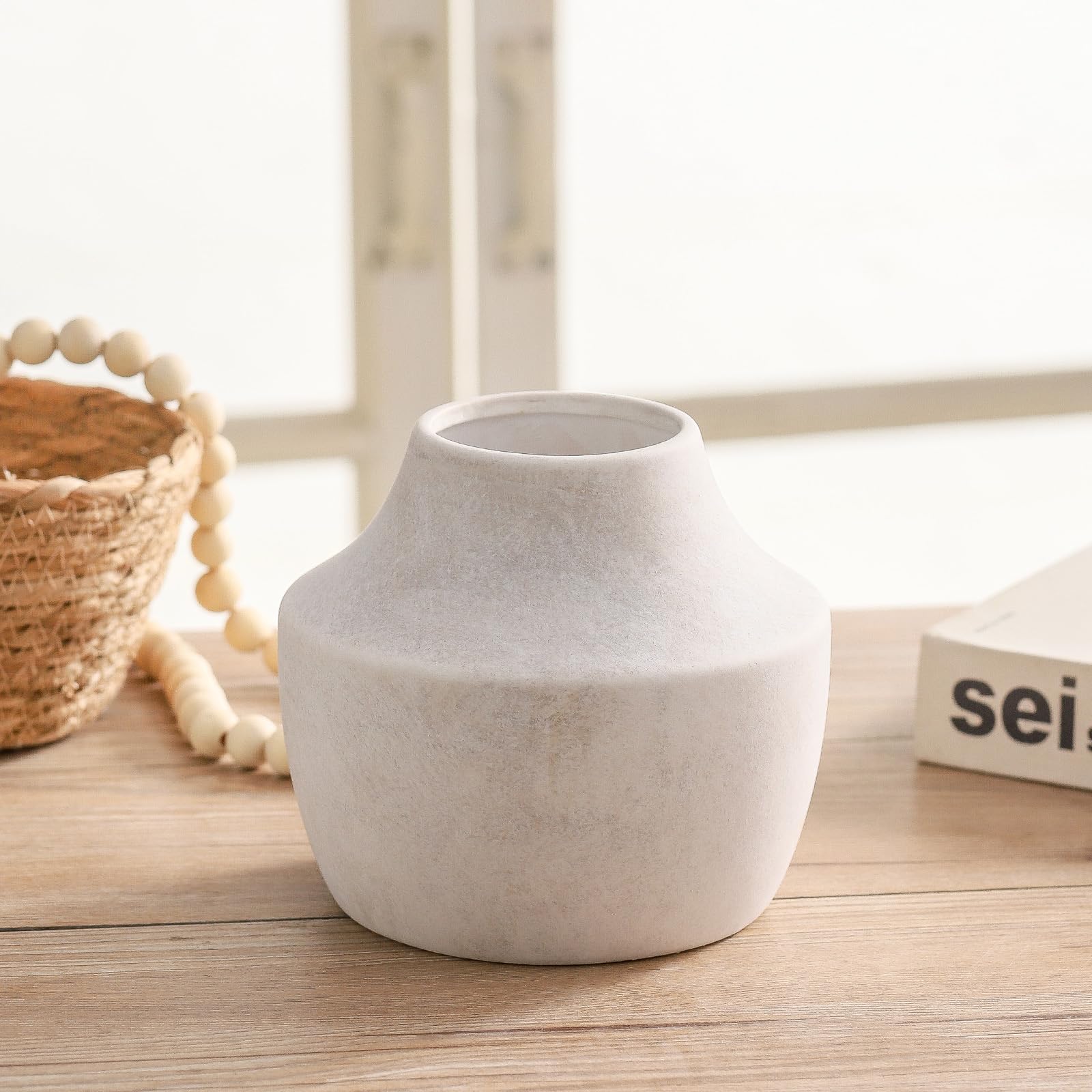 Mitt&Ditt off-white farmhouse vase on a modern mantle elevates subtle decor.