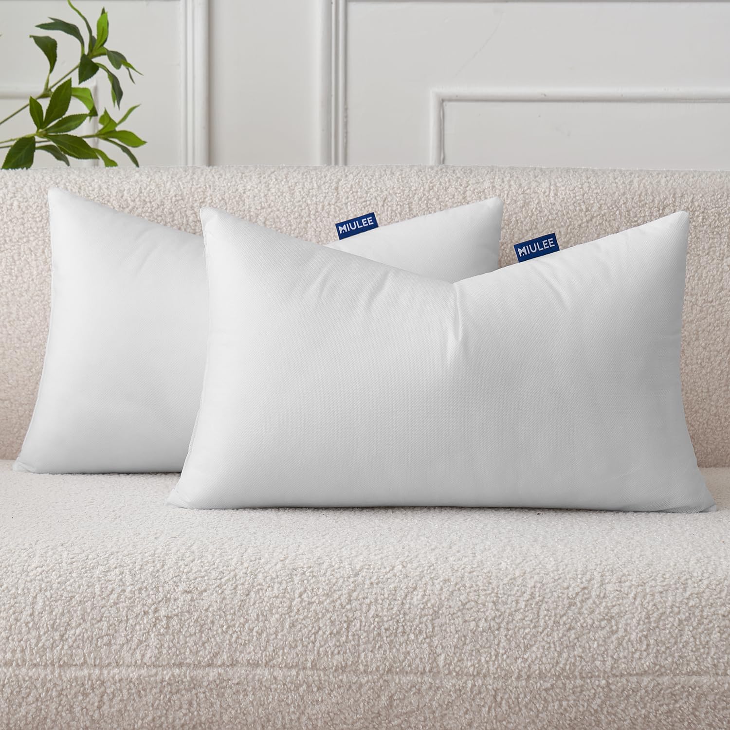 MIULEE 12x20 pillow insert on a sofa adds comfortable fullness.