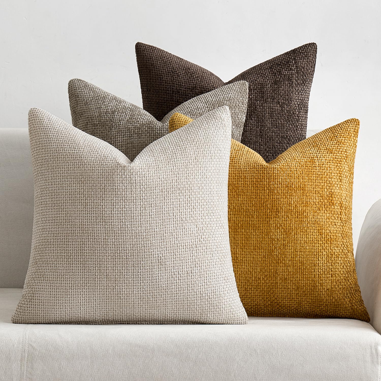 MIULEE 4-pack 18x18 pillow covers on a couch for neutral chic decor.