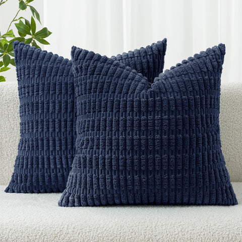 MIULEE corduroy pillow cover in dark blue enhances sofa coziness with a striped accent.