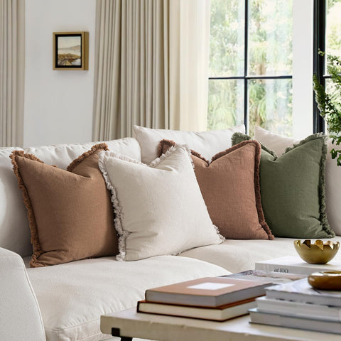 MIULEE linen pillow cover on bed or couch for cohesive farmhouse decor.