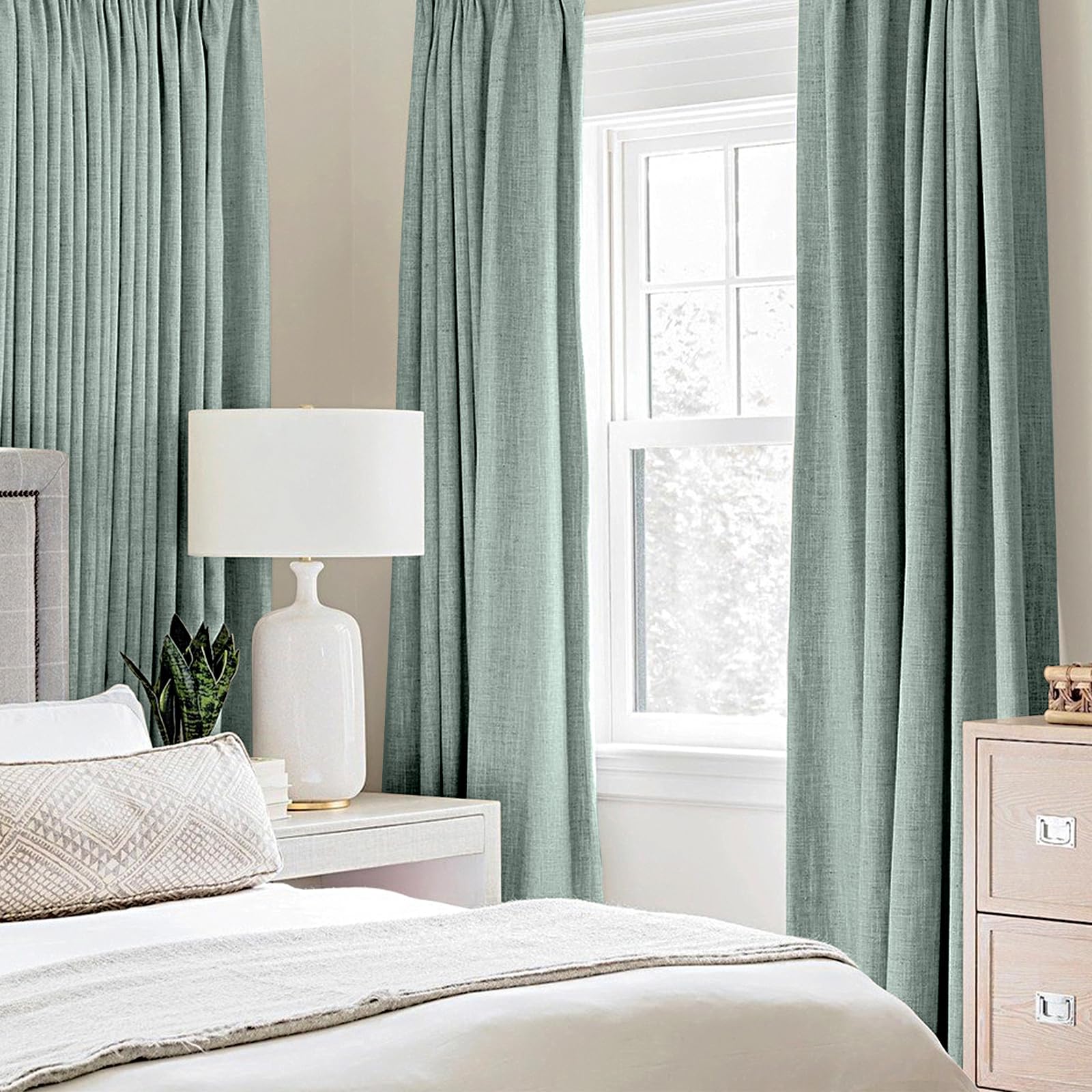 MIULEE seafoam green blackout curtains closeup showing light blocking benefits.