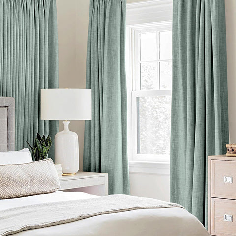 MIULEE seafoam green blackout curtains closeup showing light blocking benefits.