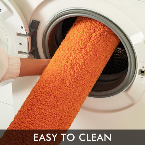 MIULEE orange bathroom mat with cloud-soft feel enhances post-shower comfort.