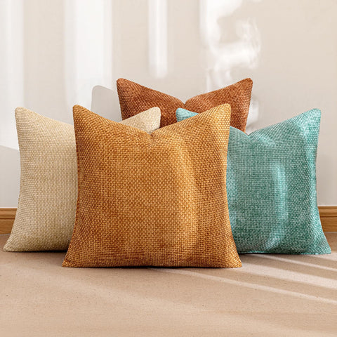 MIULEE orange-teal pillow on a sofa enhances cozy living room style.