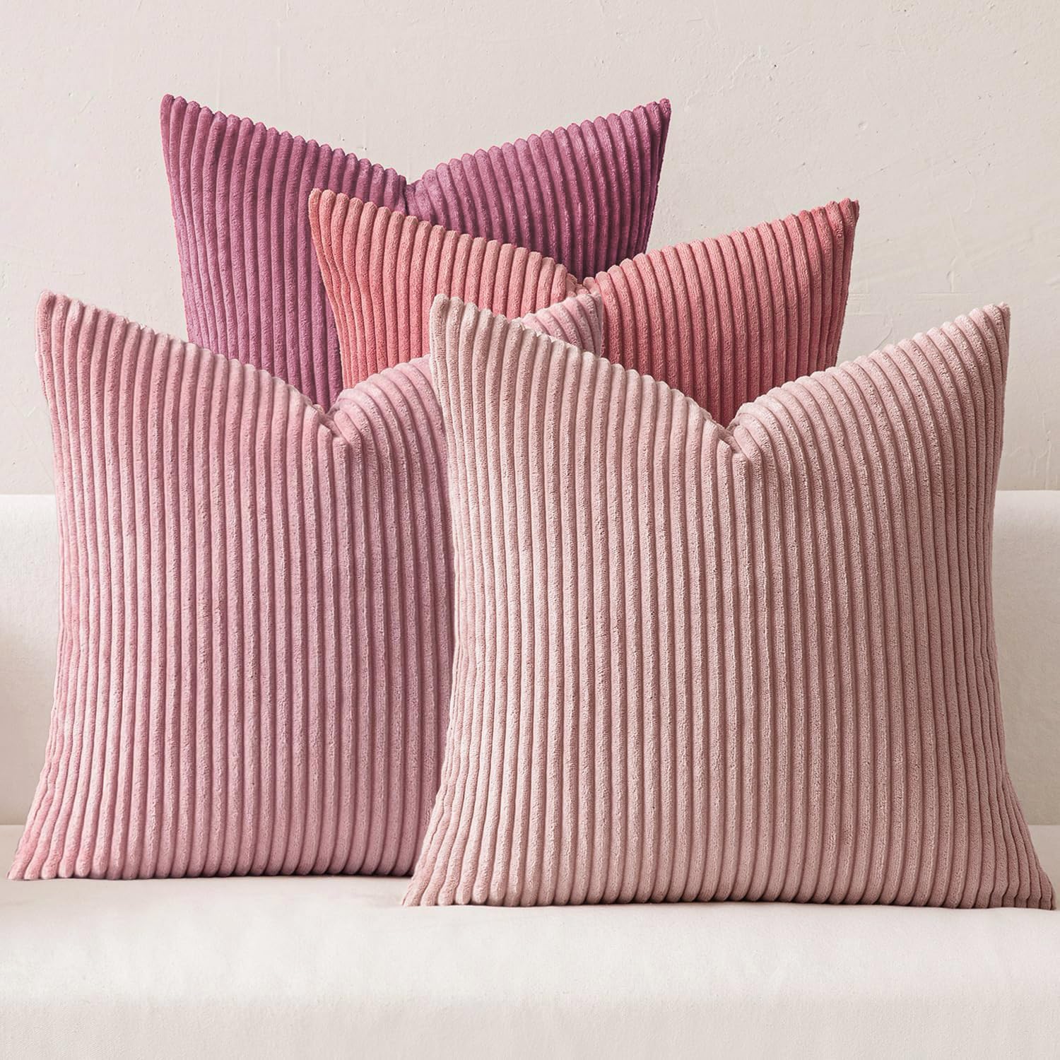 MIULEE pack of four purple-pink corduroy pillow covers on a sofa for boho decor