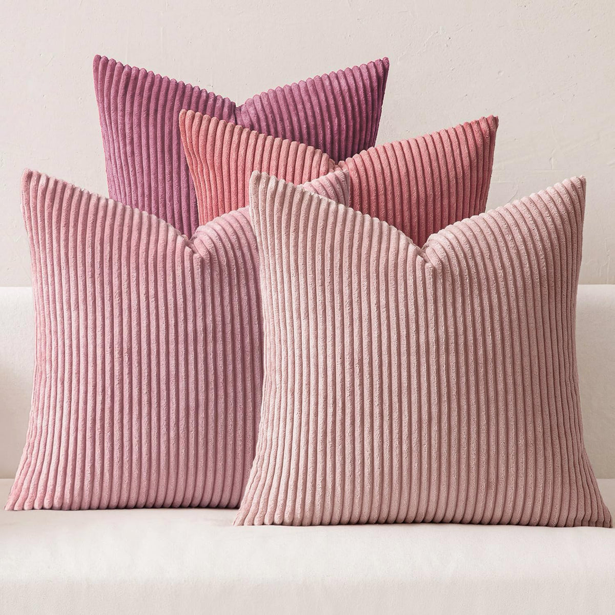 MIULEE pack of four purple-pink corduroy pillow covers on a sofa for boho decor