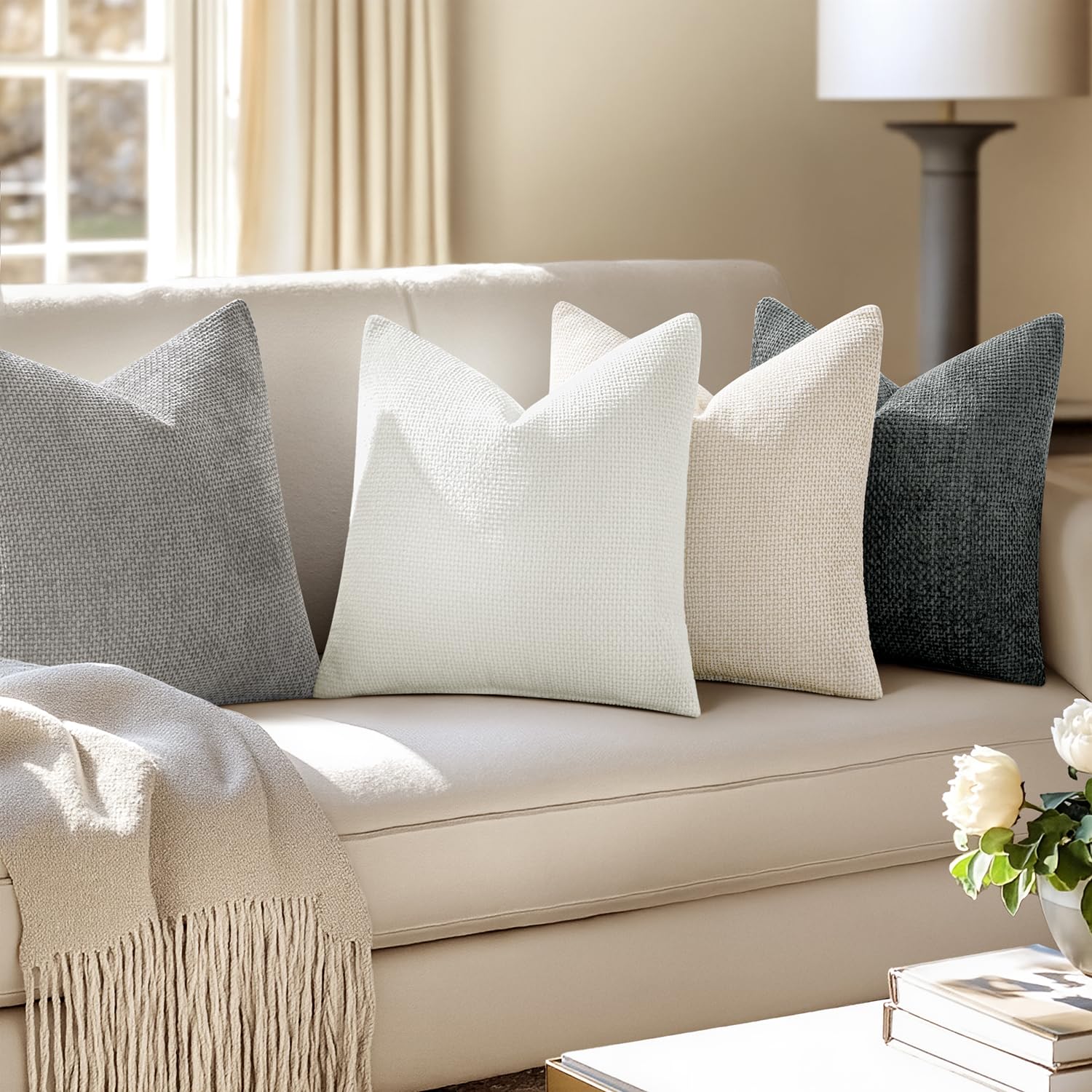 MIULEE pillow cover on a sofa adds decorative flair to a living room.