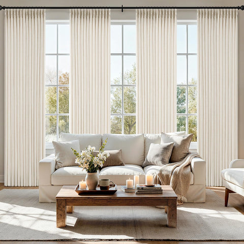MIULEE pinch-pleated linen curtains in ivory offer privacy while filtering natural light.