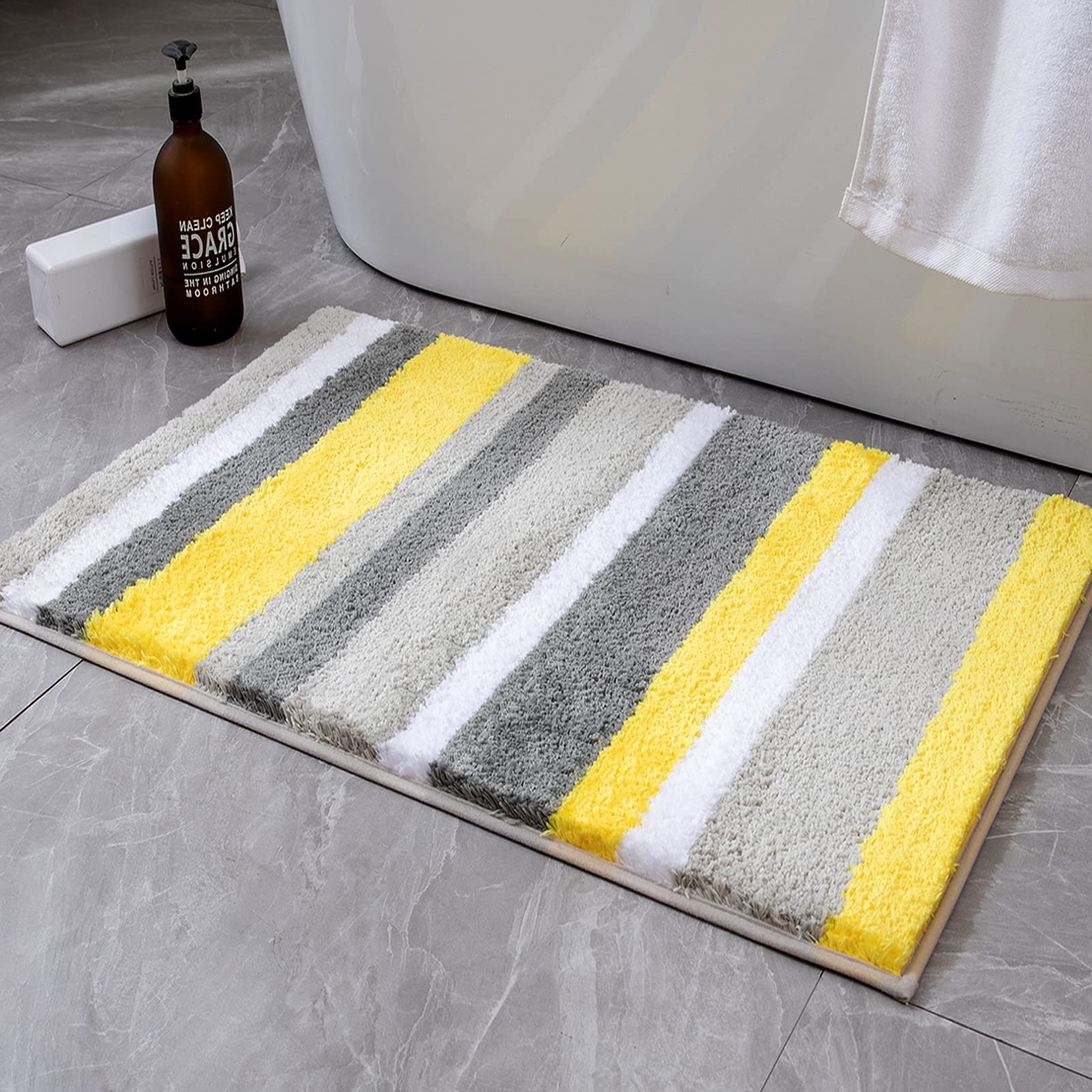 MIULEE yellow grey striped bath rug on a clean floor, offering soft warmth and style.