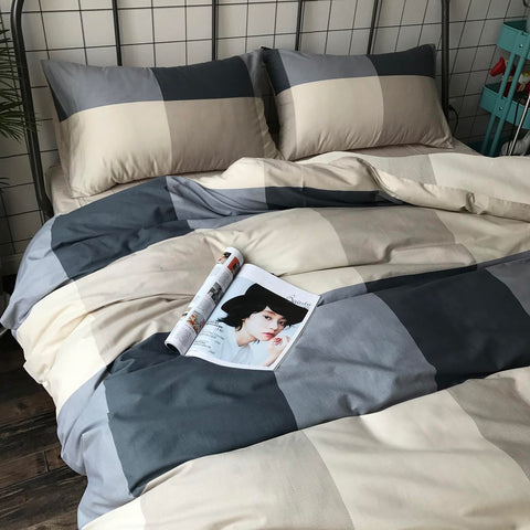 Mixinni two pillowcases included complete the matching plaid look.
