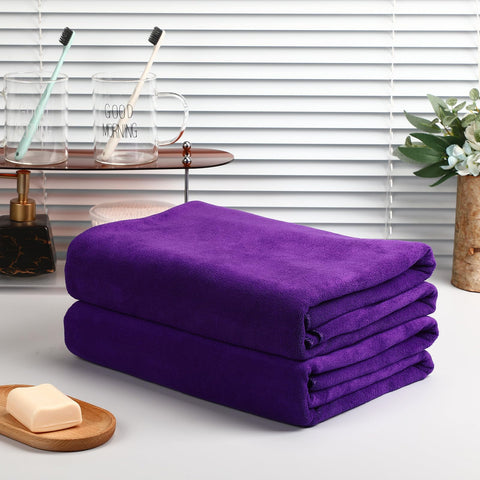 Giant Mixweer bath sheet 80x40 inches demonstrating wrap capability and fast drying.