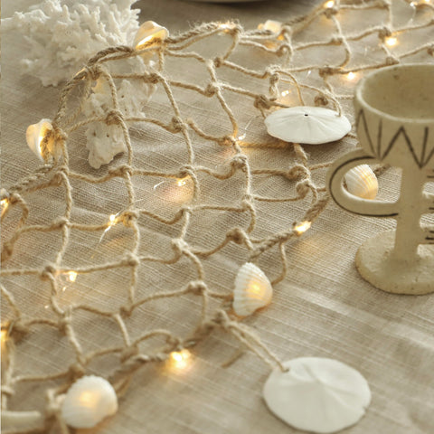MIYA LIFE sand dollars and shells add seaside texture to any wall.