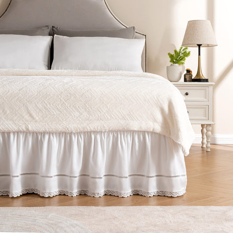 MIYE wrap around ruffled lace bed skirt on bed shows elegant embroidery for a refined look