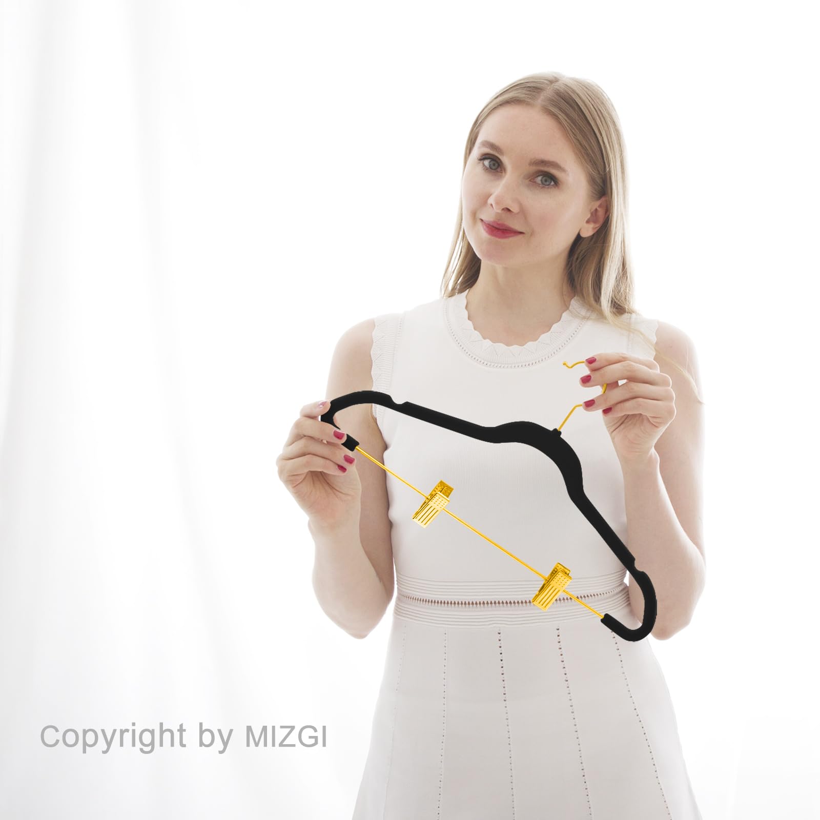 MIZGI black velvet hangers with durable clips for everyday use.