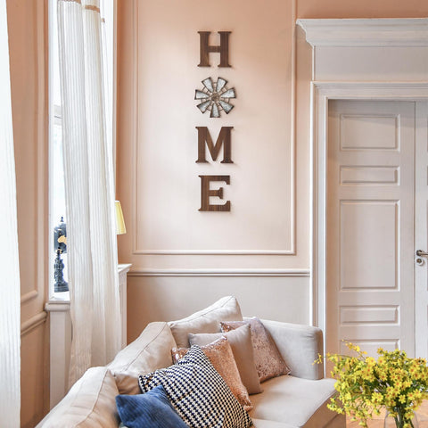 Mkono farmhouse wall decor windmill O highlights coastal farmhouse flair on walls.