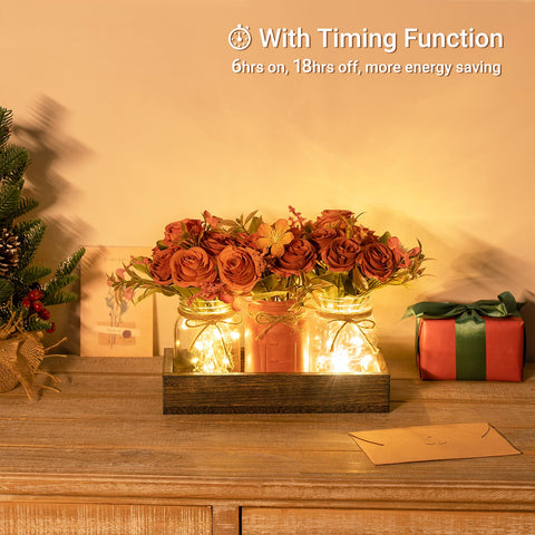 Mkono three jars with flowers illuminated softly for cozy living room decor