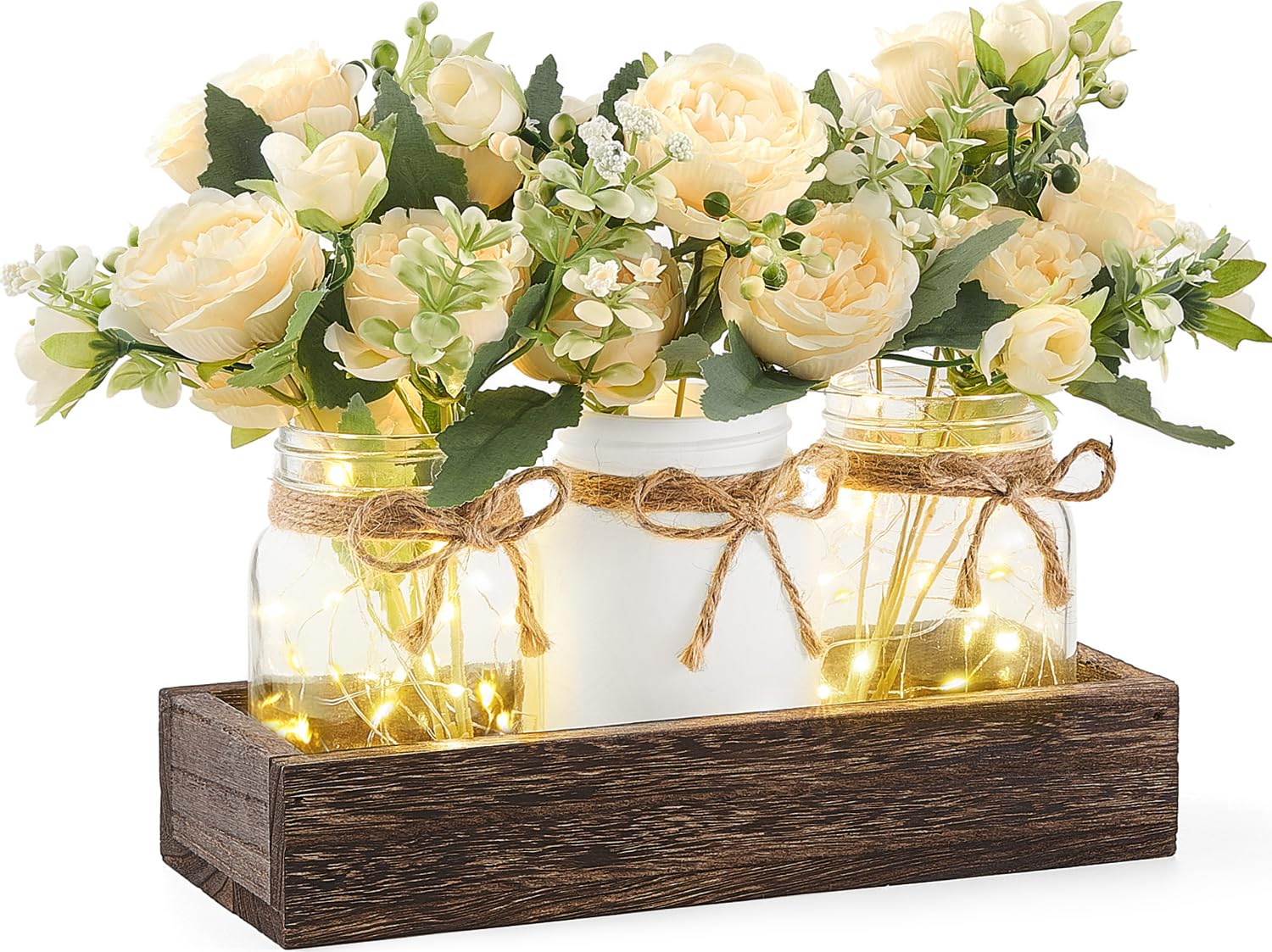 Mkono mason jar lights centerpiece on wooden box for warm dining table ambiance.