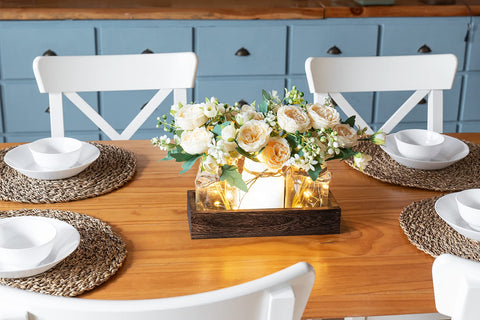 Mkono wood tray holds three jars and faux flowers for versatile centerpiece.
