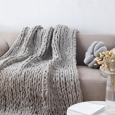 MocaDng blanket on sofa enhances living room decor in gray