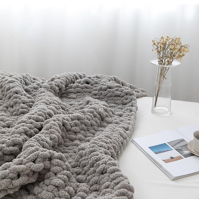 MocaDng soft cozy throw decorating a sofa in gray