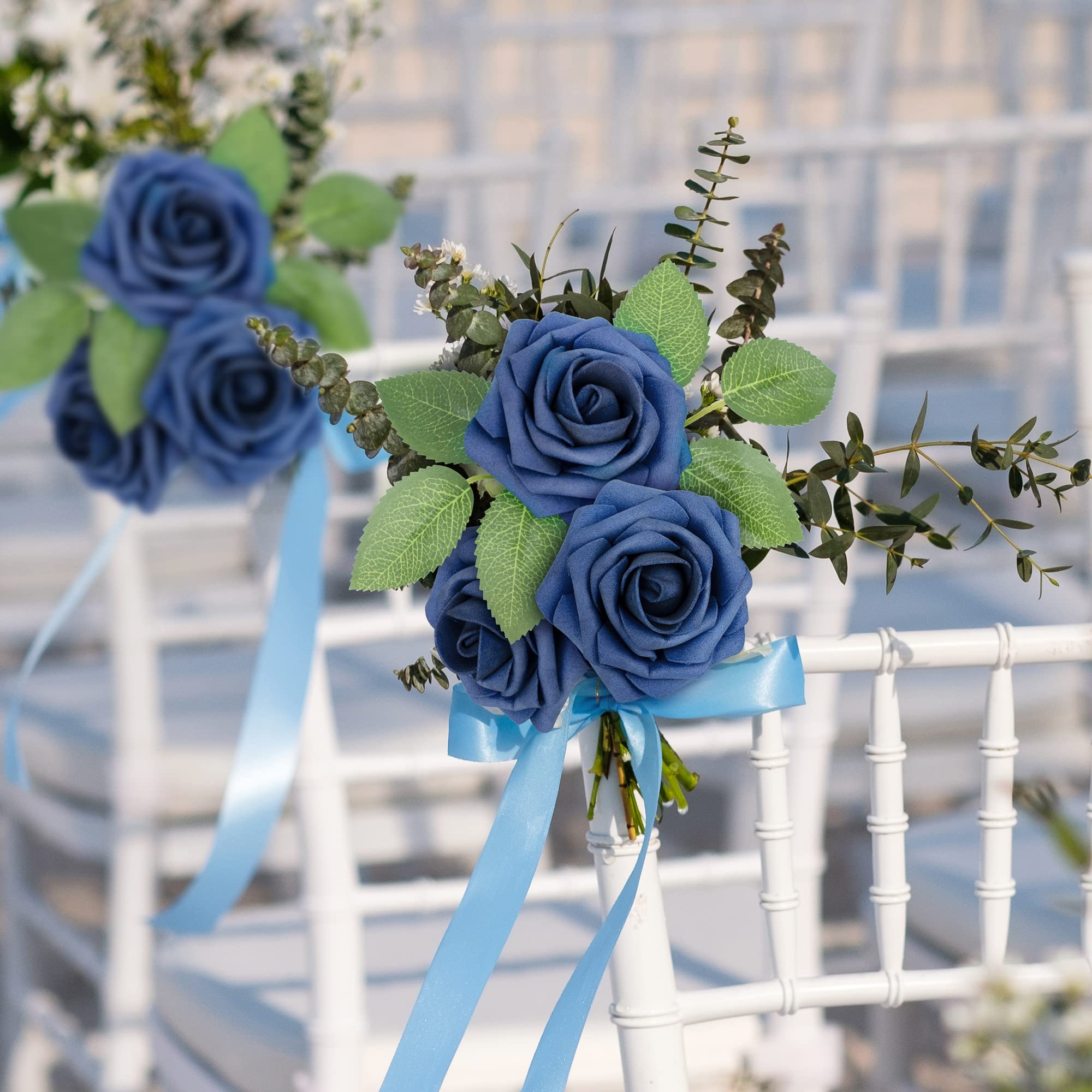 Mocoosy cake flower accents using navy-blue roses for elegant decoration.