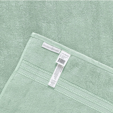 Modern Threads Artesia Damask Sage towel set displayed in bathroom decor.