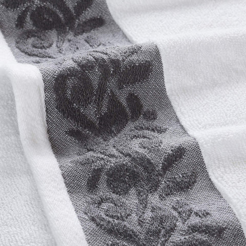 Modern Threads filgree border charcoal close-up on towel edge.
