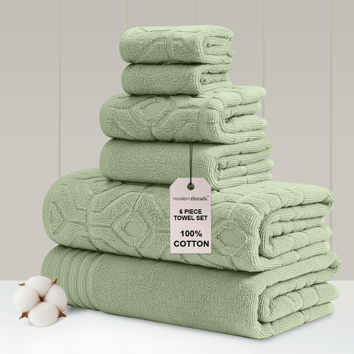 Modern Threads soft olive bath towels on a rack show plush quality for everyday luxury.