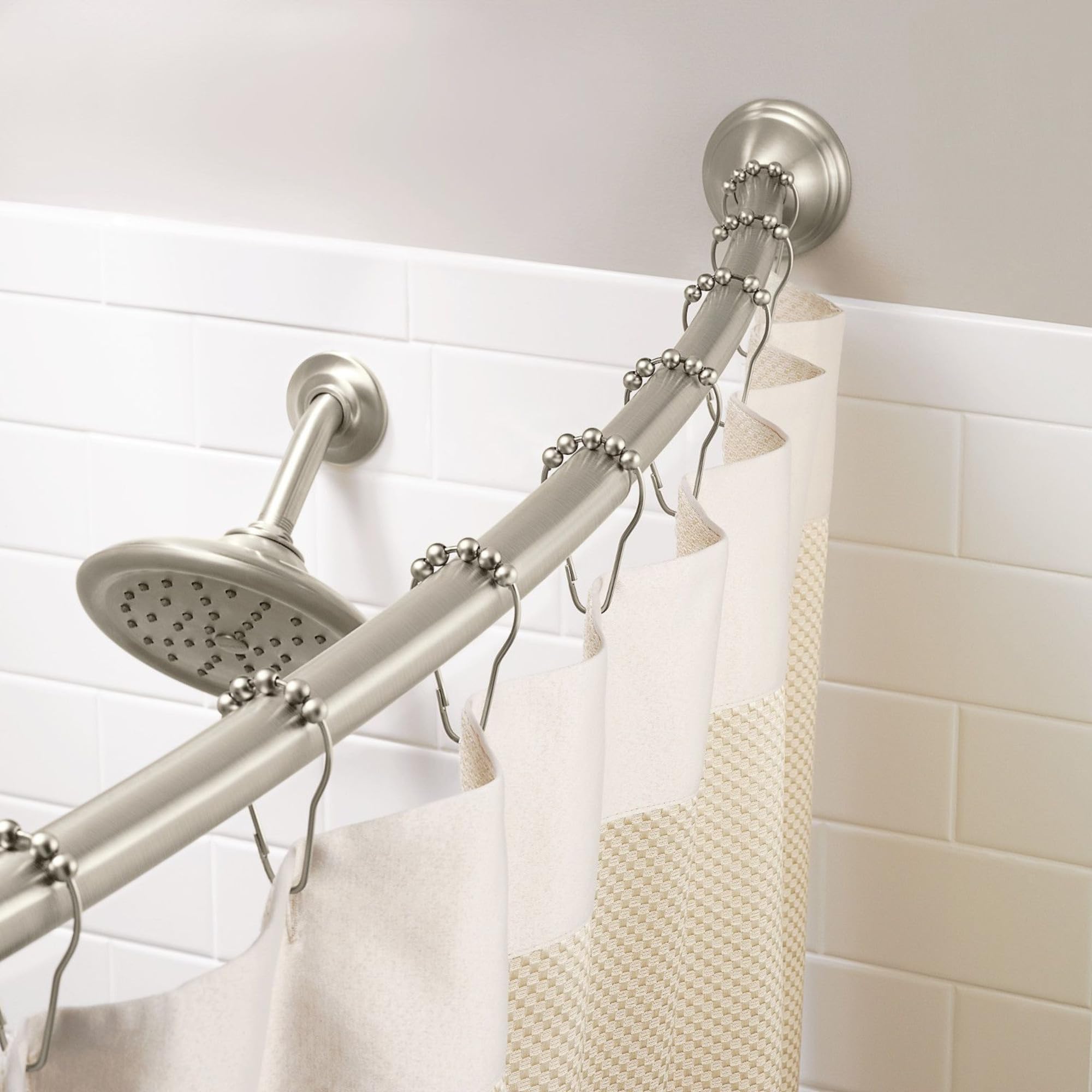 Moen curved rod decorative covers conceal mounting hardware for a clean look.