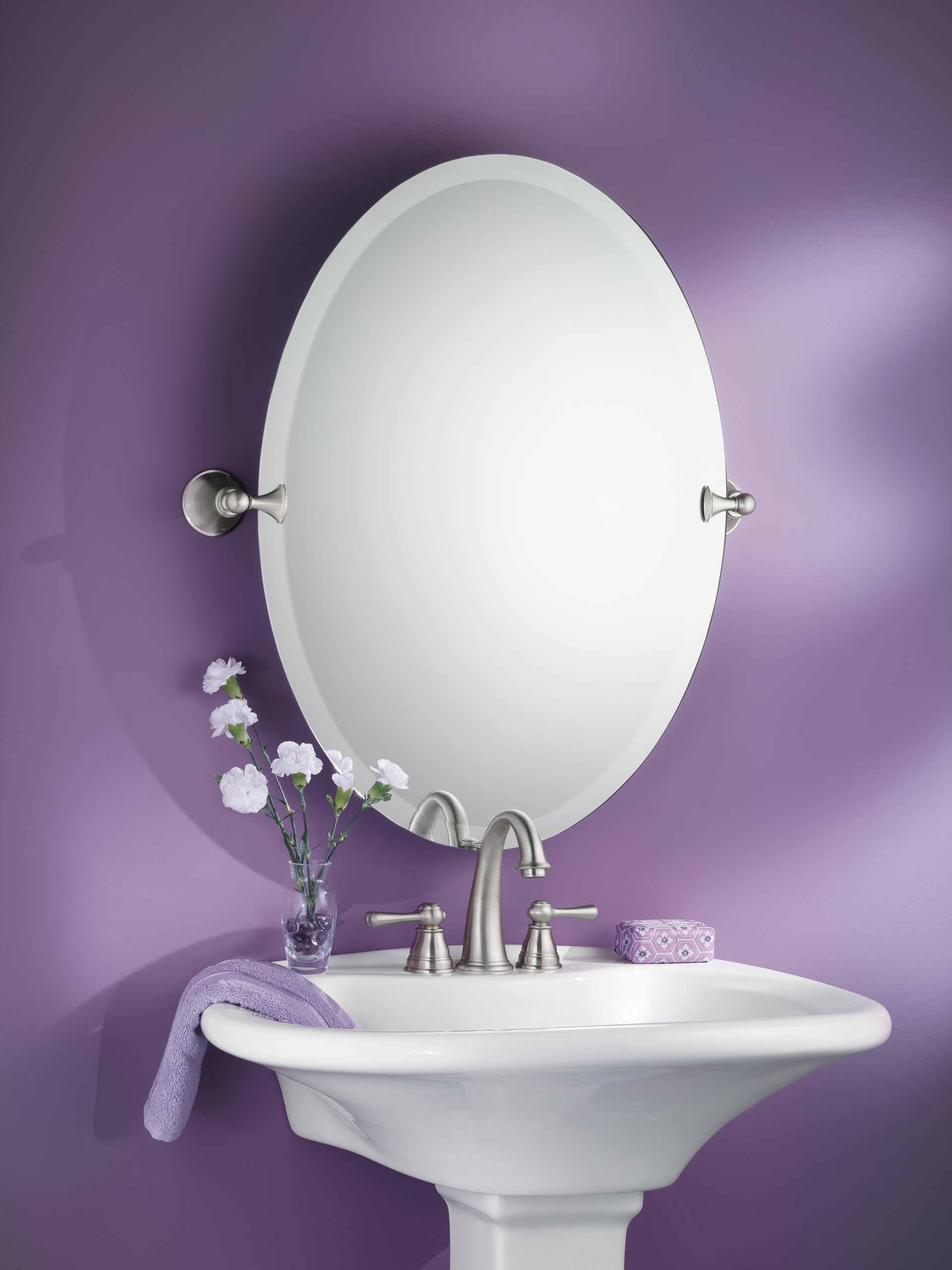 Wall-mounted vanity mirror is straightforward to install with essential hardware.