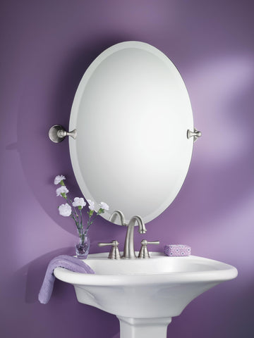 Wall-mounted vanity mirror is straightforward to install with essential hardware.