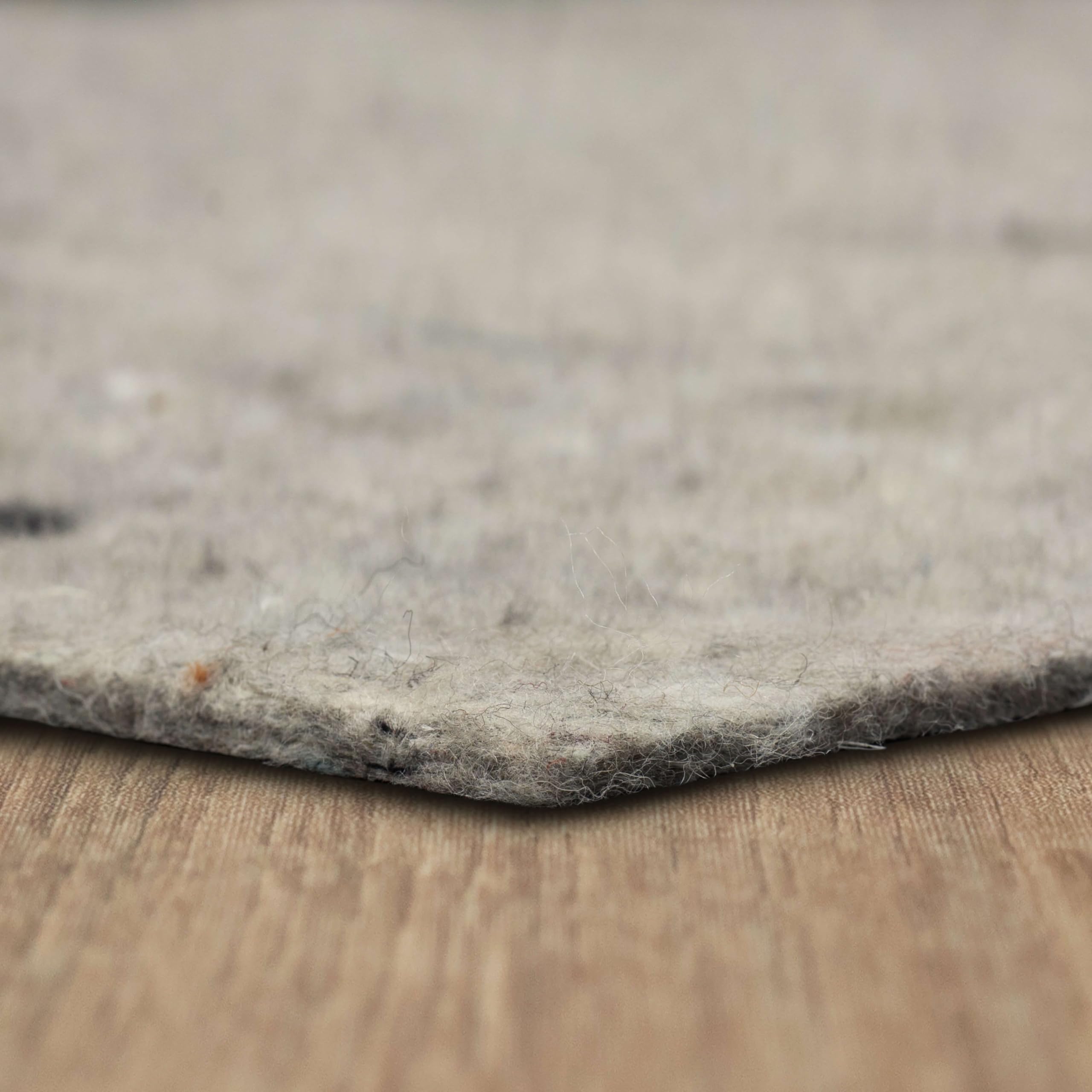 Mohawk Home felt rug pad 10x14 shown under a rug for floor protection.