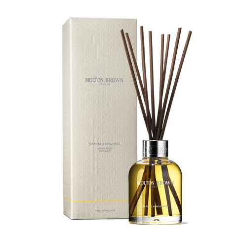 Molton Brown Orange & Bergamot Aroma Reeds bottle with reeds ready to fragrance your space.