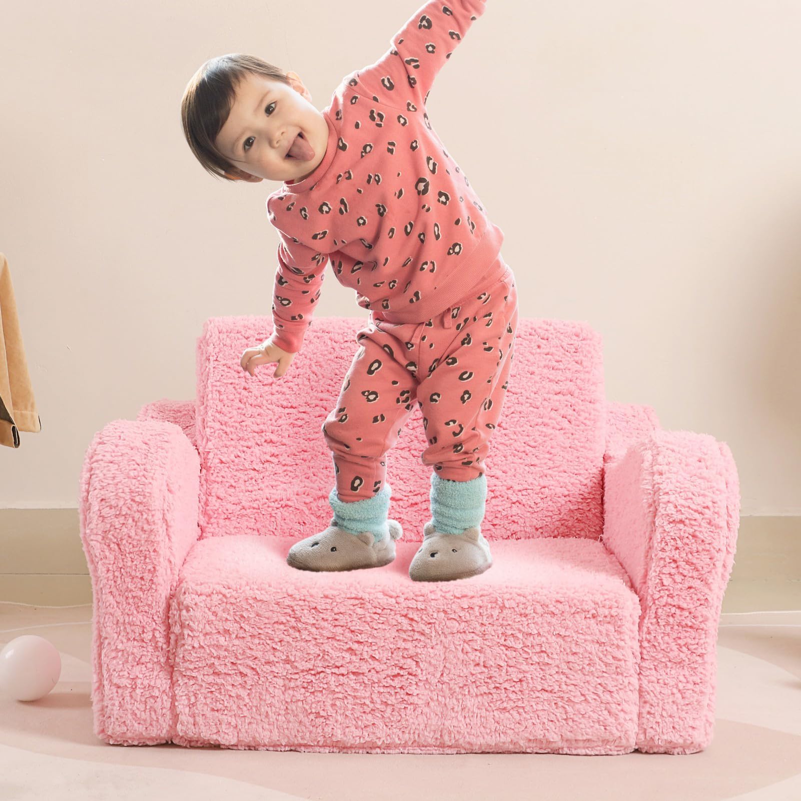 MOMCAYWEX Kids Sofa pink color complements kid-friendly rooms beautifully.