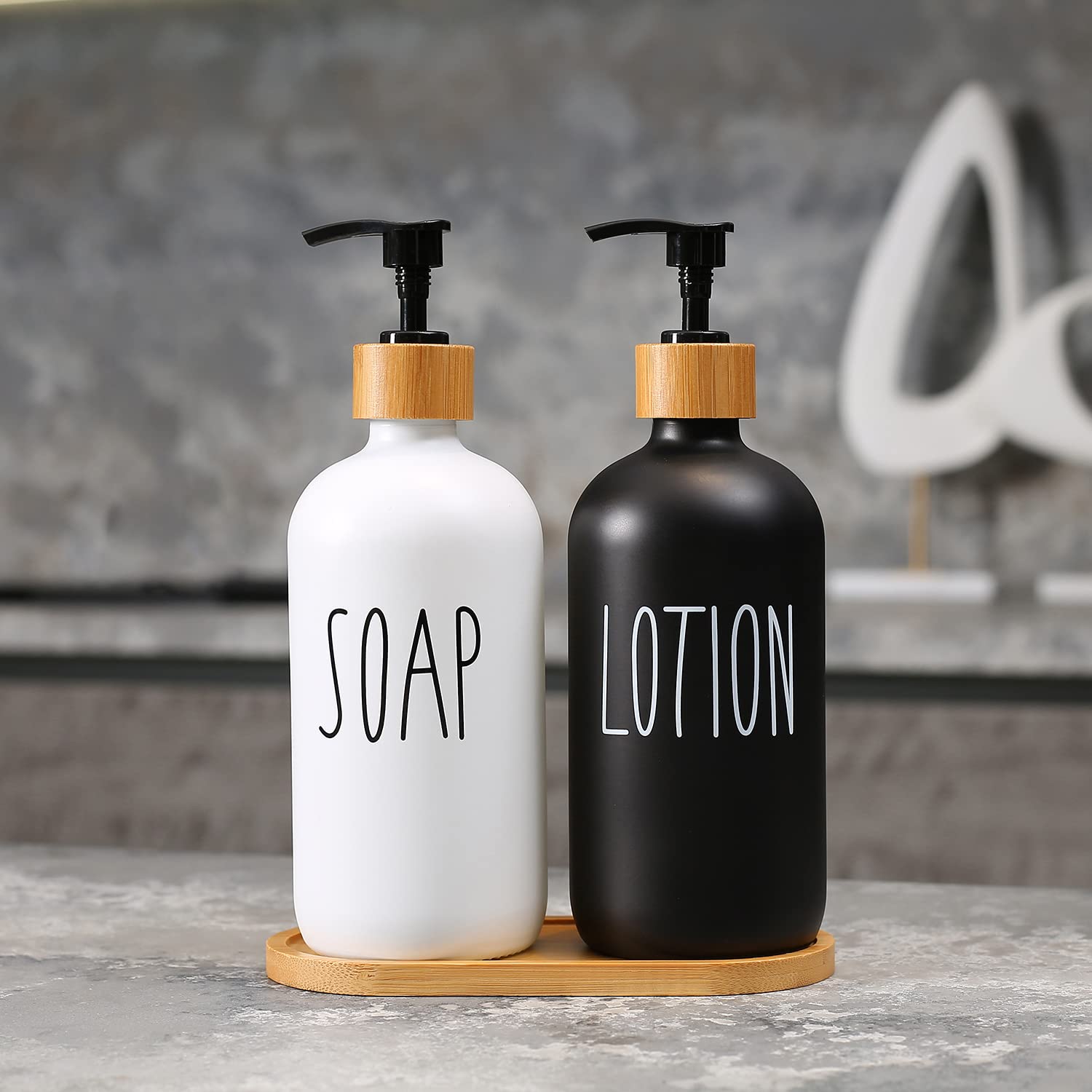 MOMEEMO hand soap dispenser glass bottle on display for modern bathrooms.