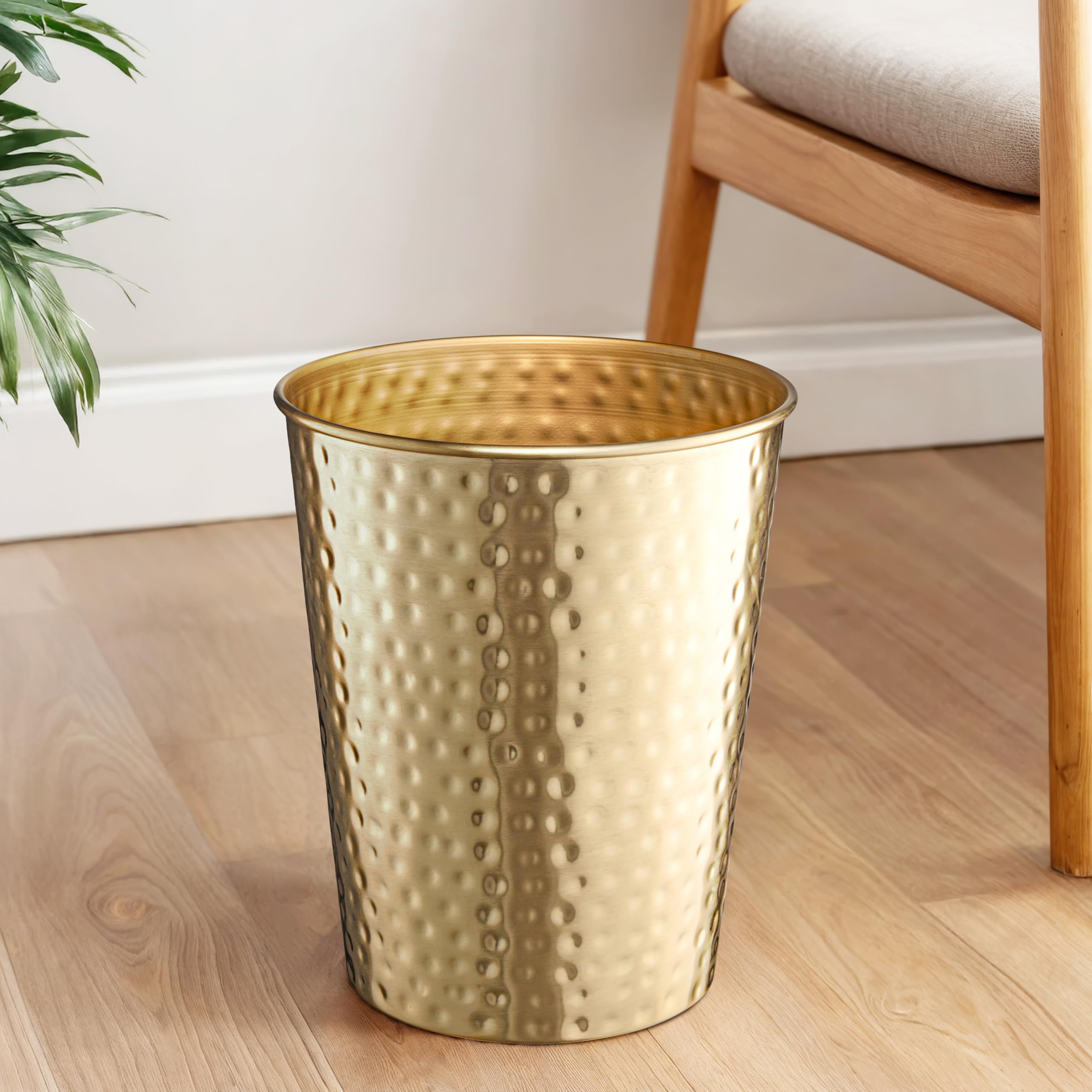 Monarch Abode rust-resistant metal trash bin combines durability with decorative appeal.