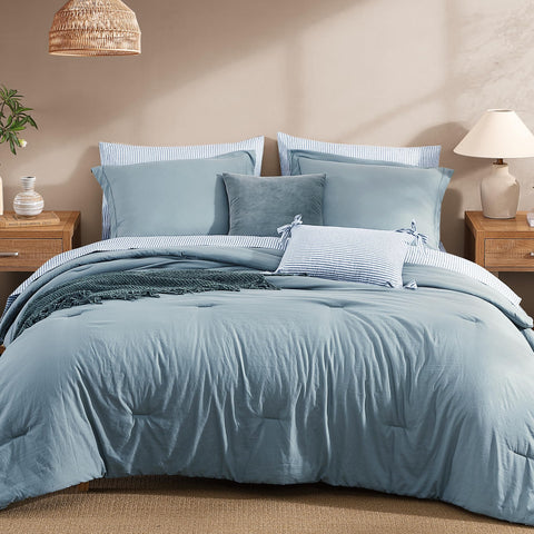 Monbix Queen comforter in dusty blue adds fluffy warmth for all-season sleep.
