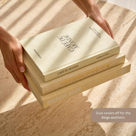 Moncur Home faux books arranged on a shelf create a calm, minimalist focal point.