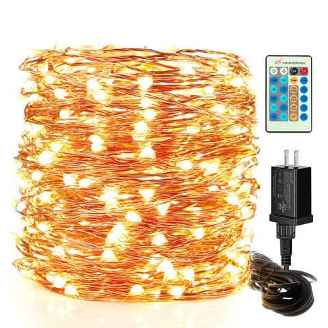 Moobibear LED string lights in an outdoor garden setup for warm evenings.