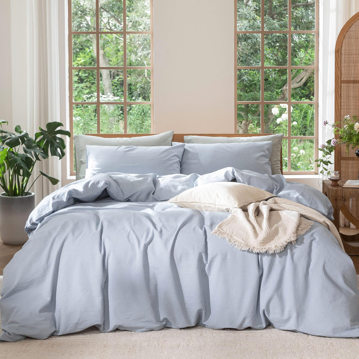 MooMee king duvet cover in cornflower blue on bed, breathable cotton texture for all-season comfort.